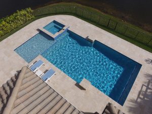 Geometric swimming pool South Florida in back yard